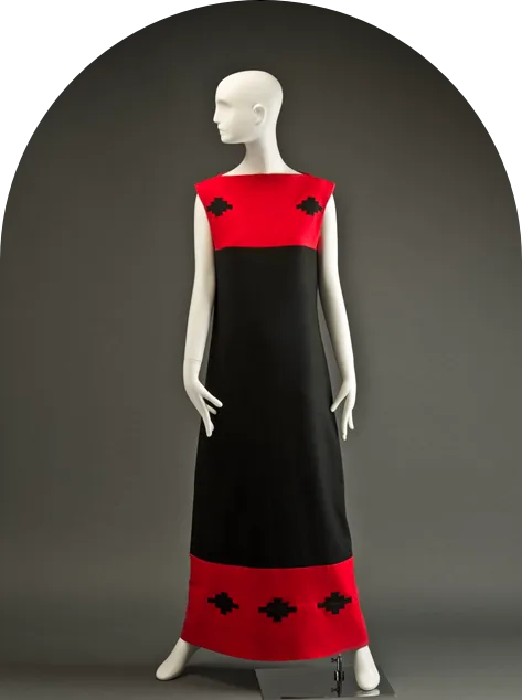 A red and black dress on a mannequin.