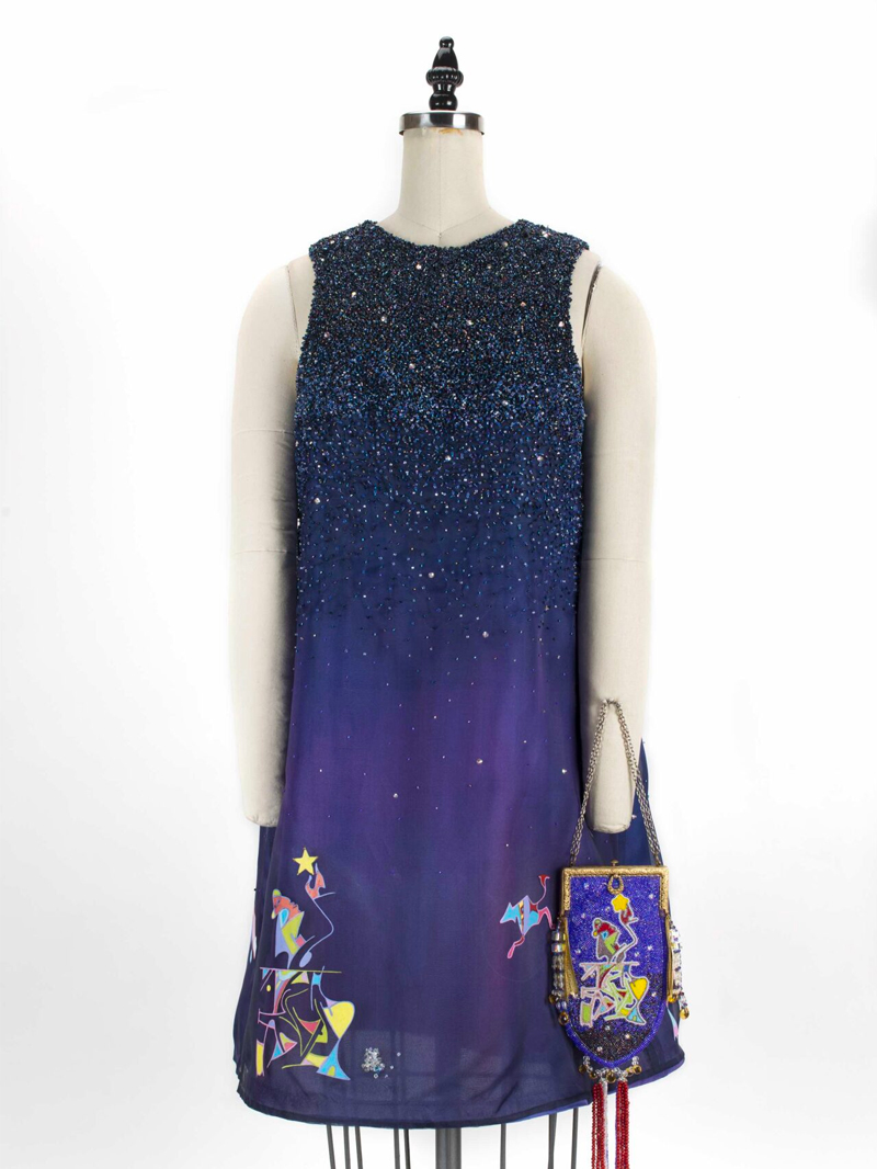 A blue dress with stars on it and a purse.