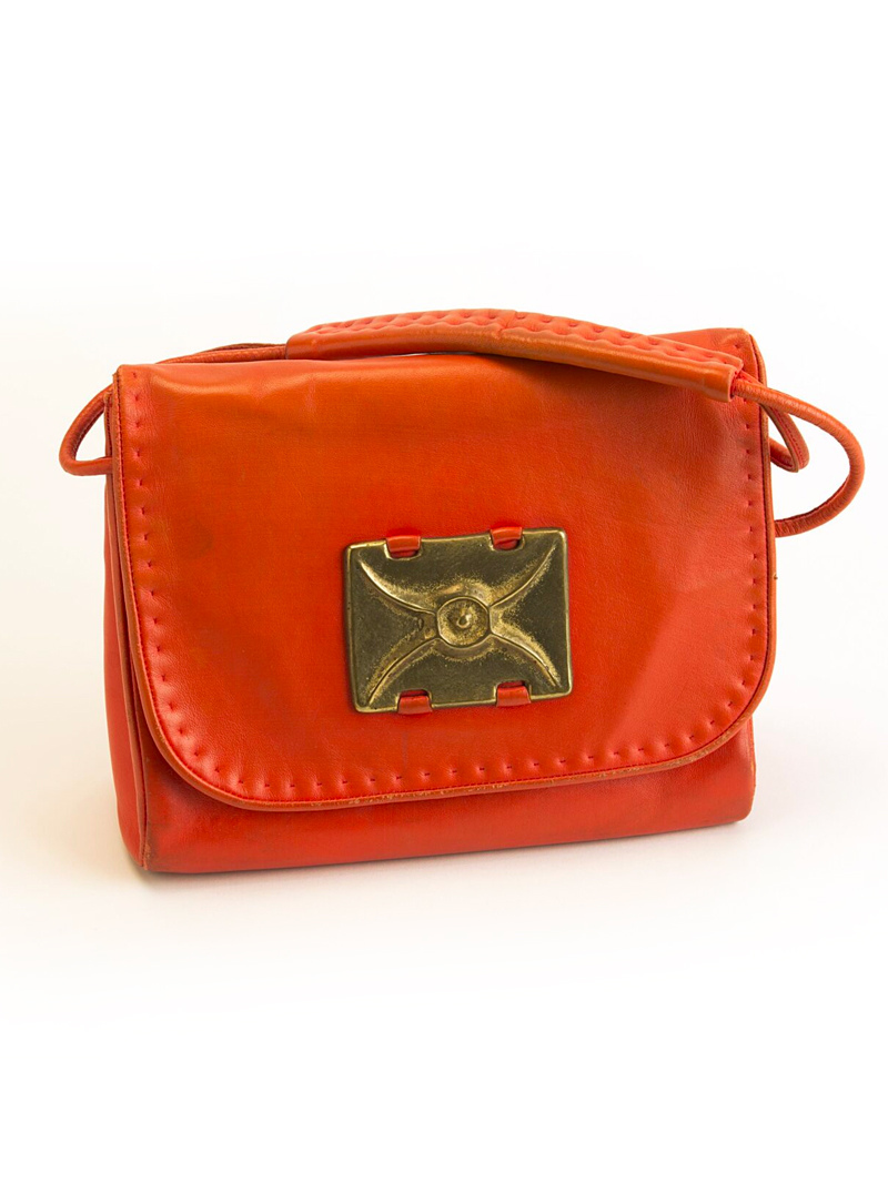A red leather bag with a metal clasp.