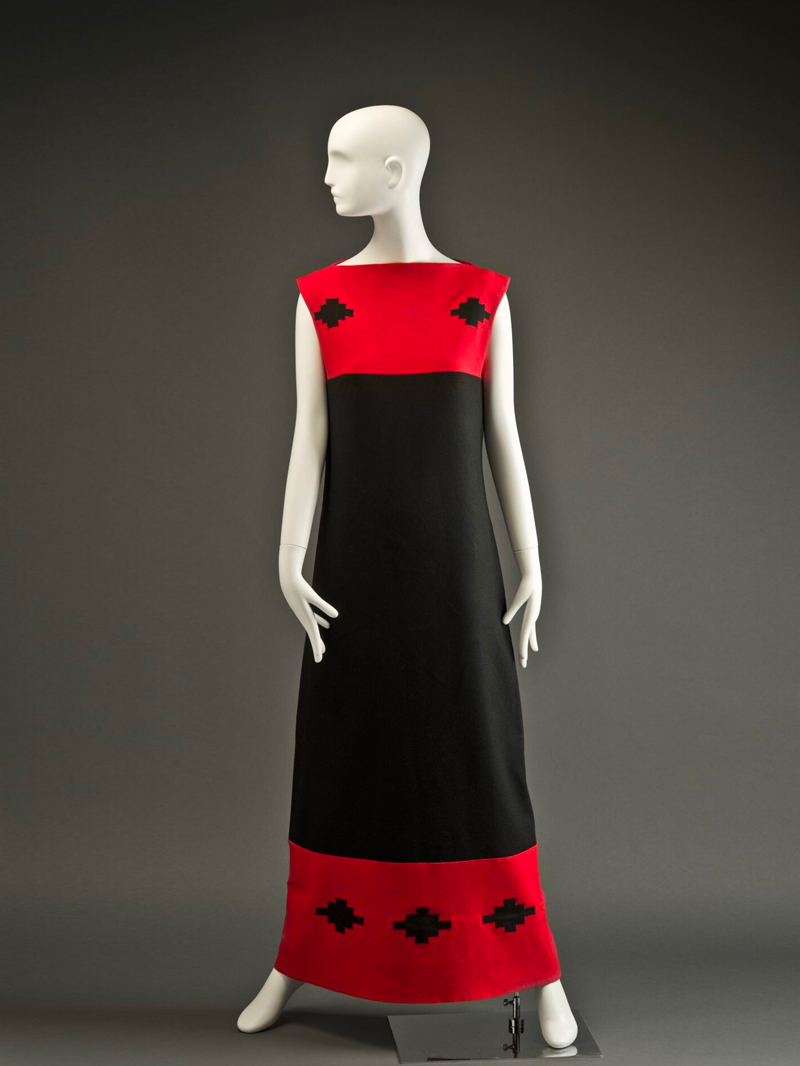 A black and red dress on a mannequin.