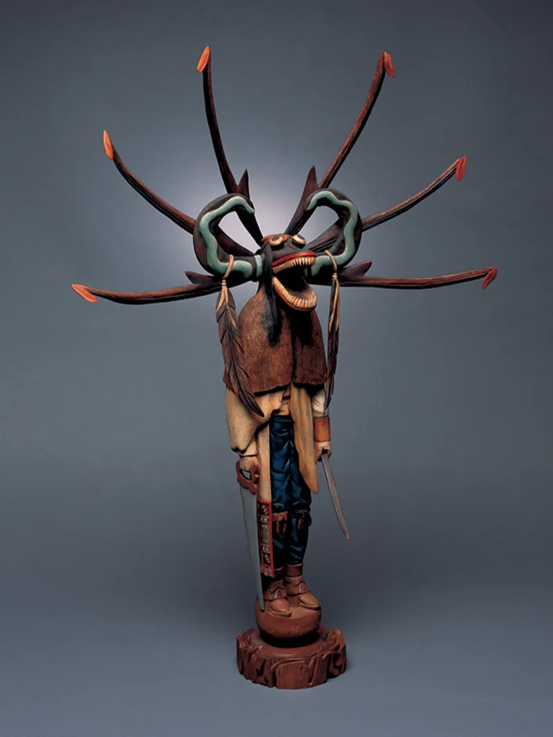A sculpture of a figure with horns on his head.