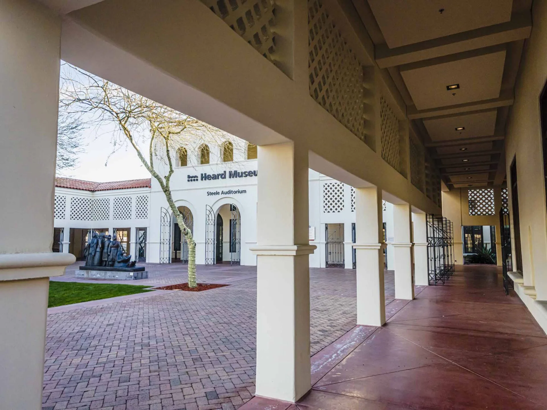 A walkway leading to the Heard Museum with columns and pillars.