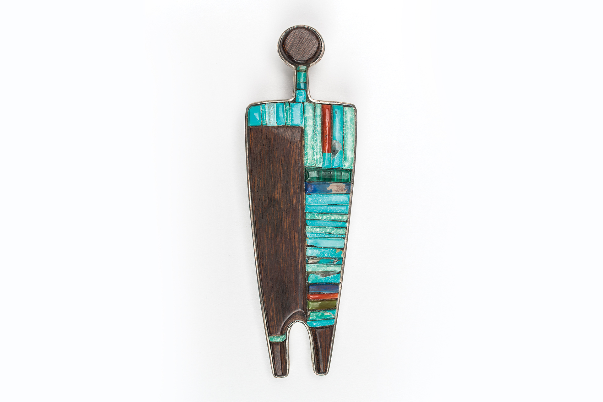 A wooden jewelry pendant with a blue and turquoise design.