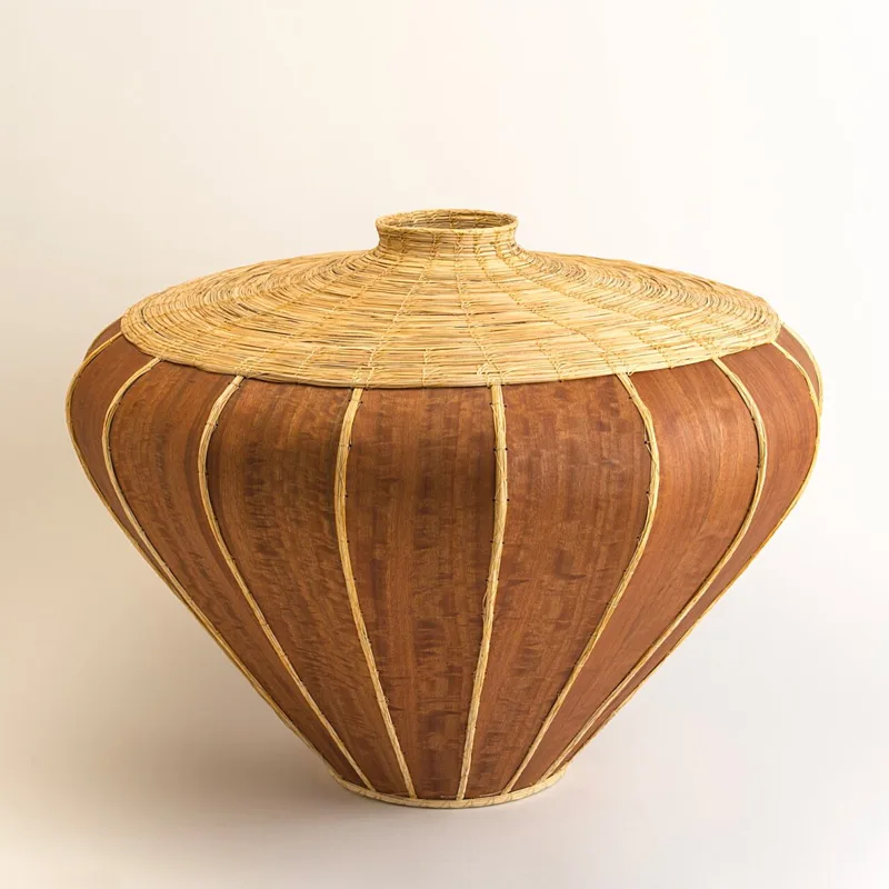 A basket made of rattan and wood.