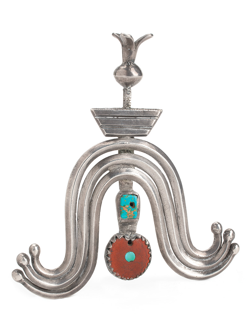 A silver pendant with a turquoise stone on it.