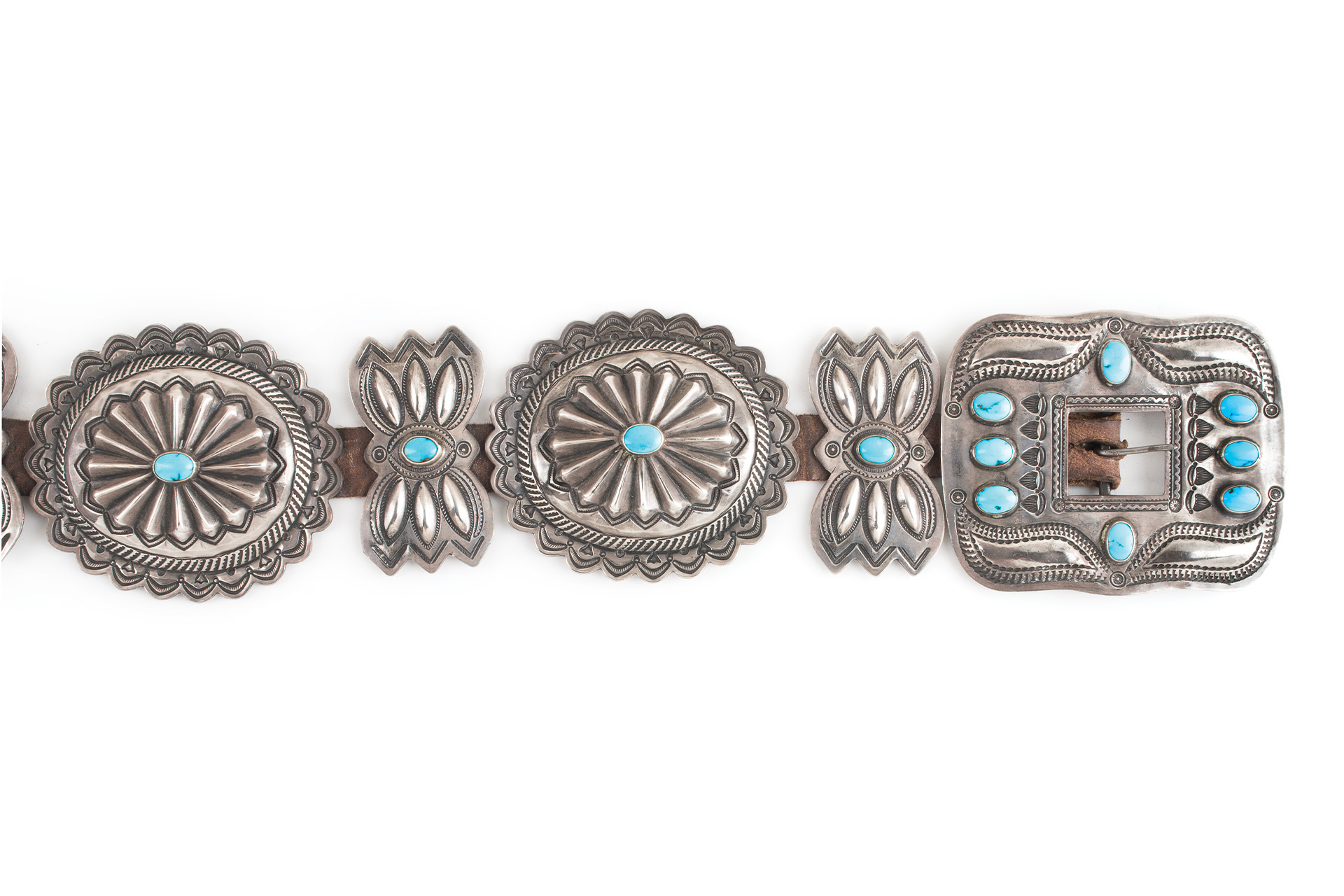 A silver belt with turquoise stones.