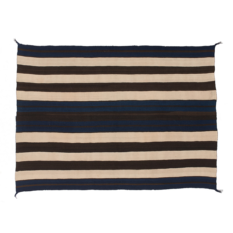 A blue and black striped Diné blanket on a white background.