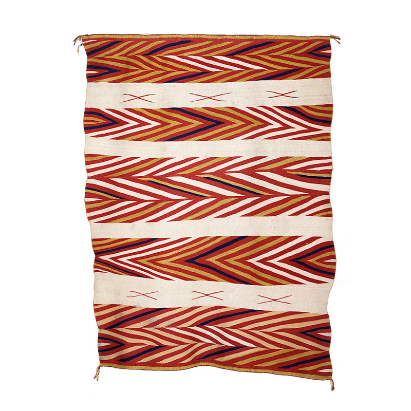 A Diné textile with red, white and yellow stripes.