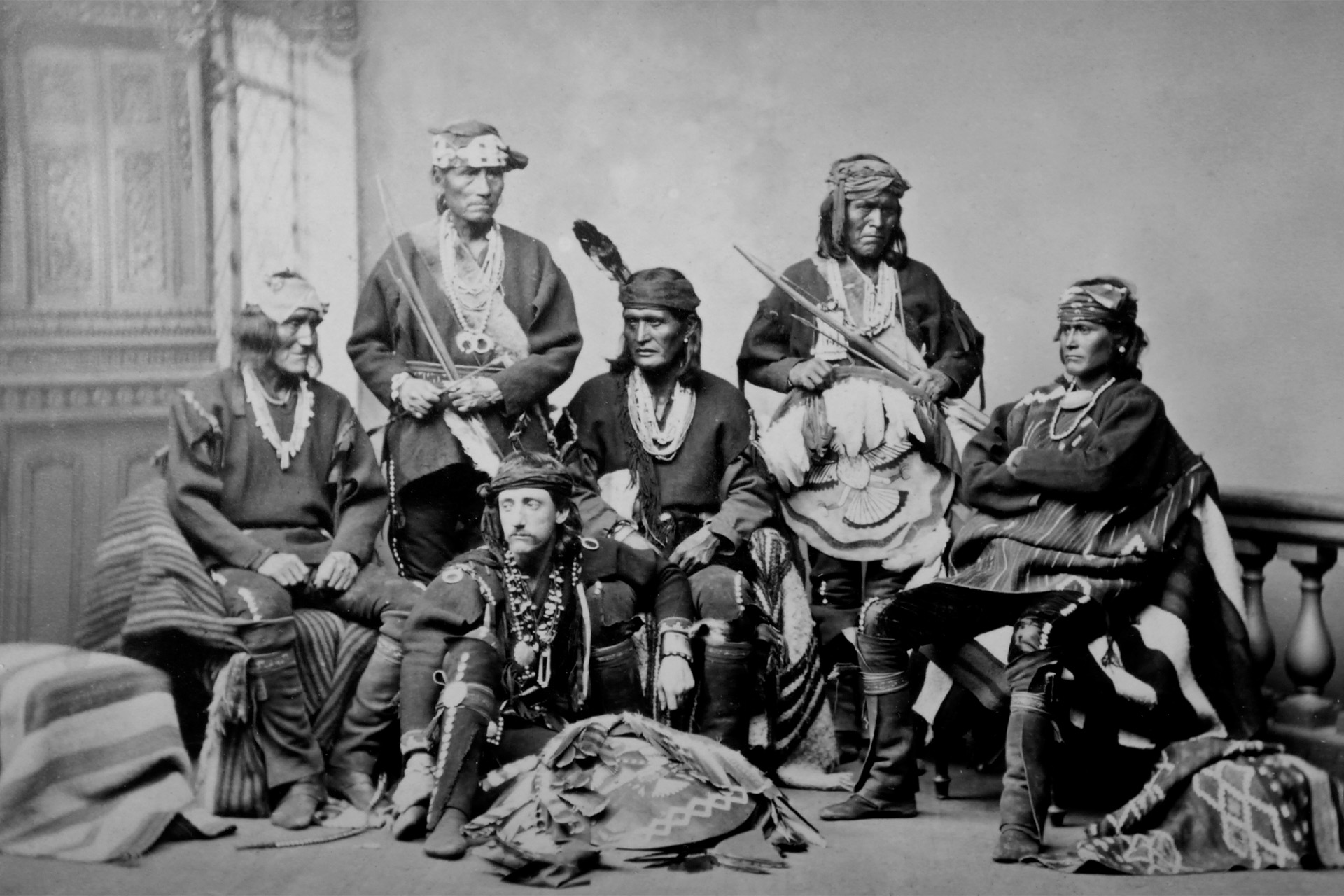 A black and white photo of a group of Zuni leaders posing for a photo.