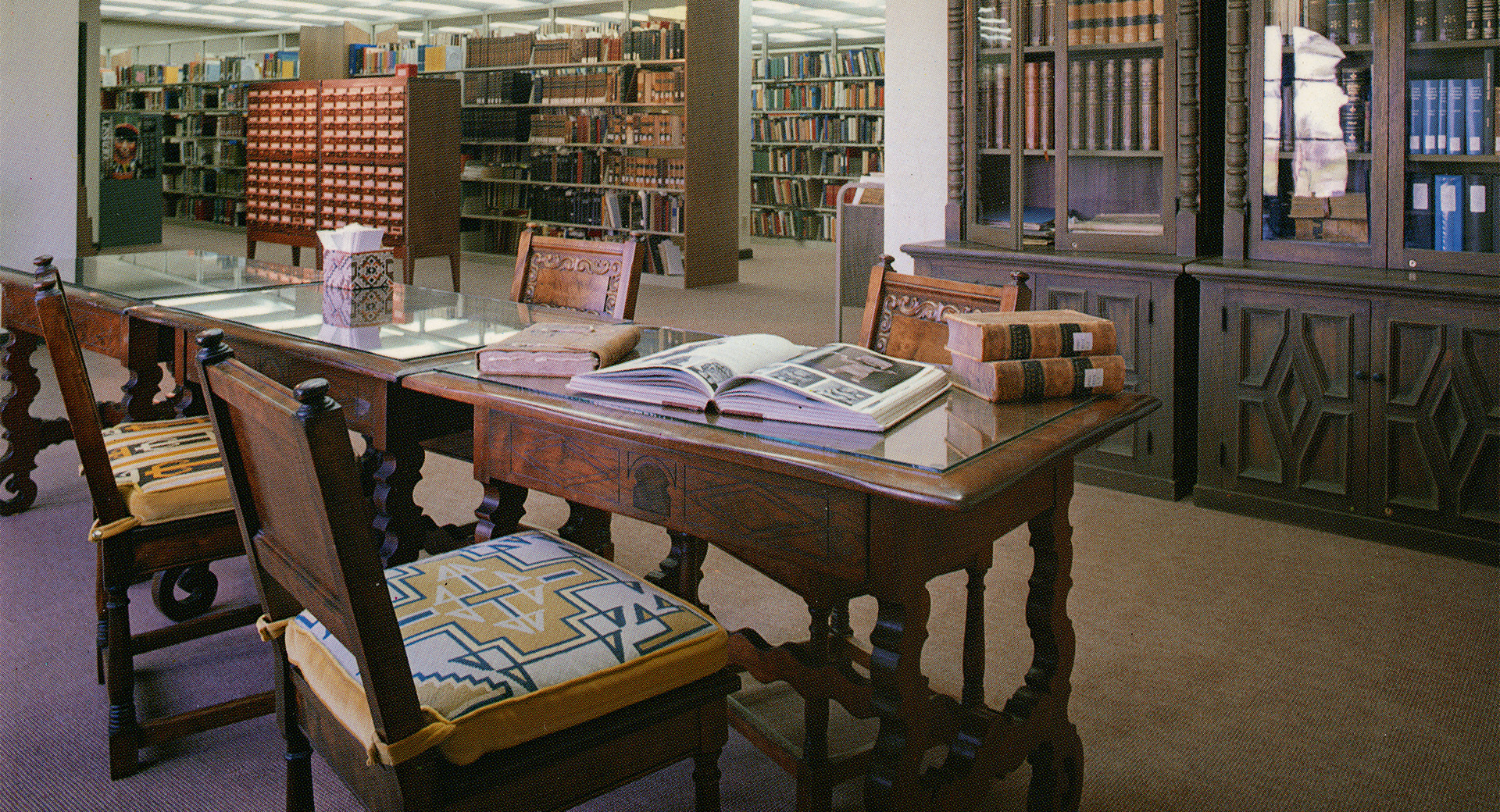 A table with books on it in a library.
