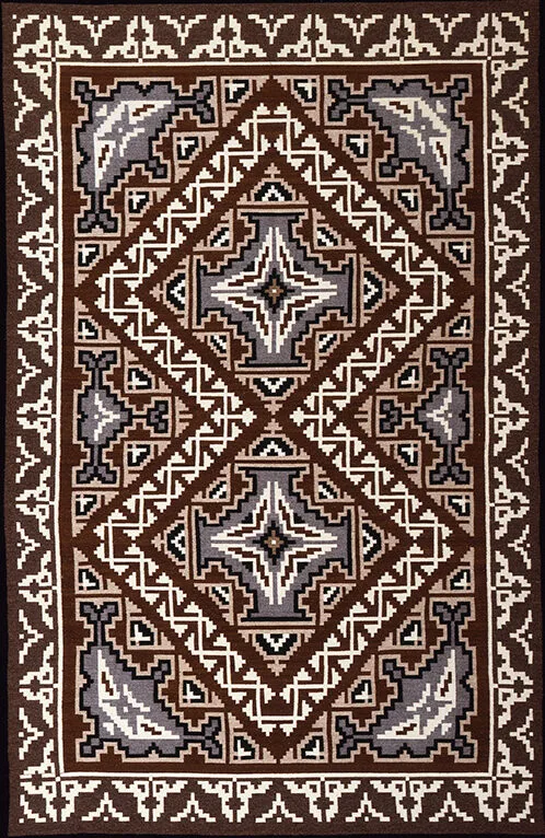 A brown and white tapestry with an ornate design.