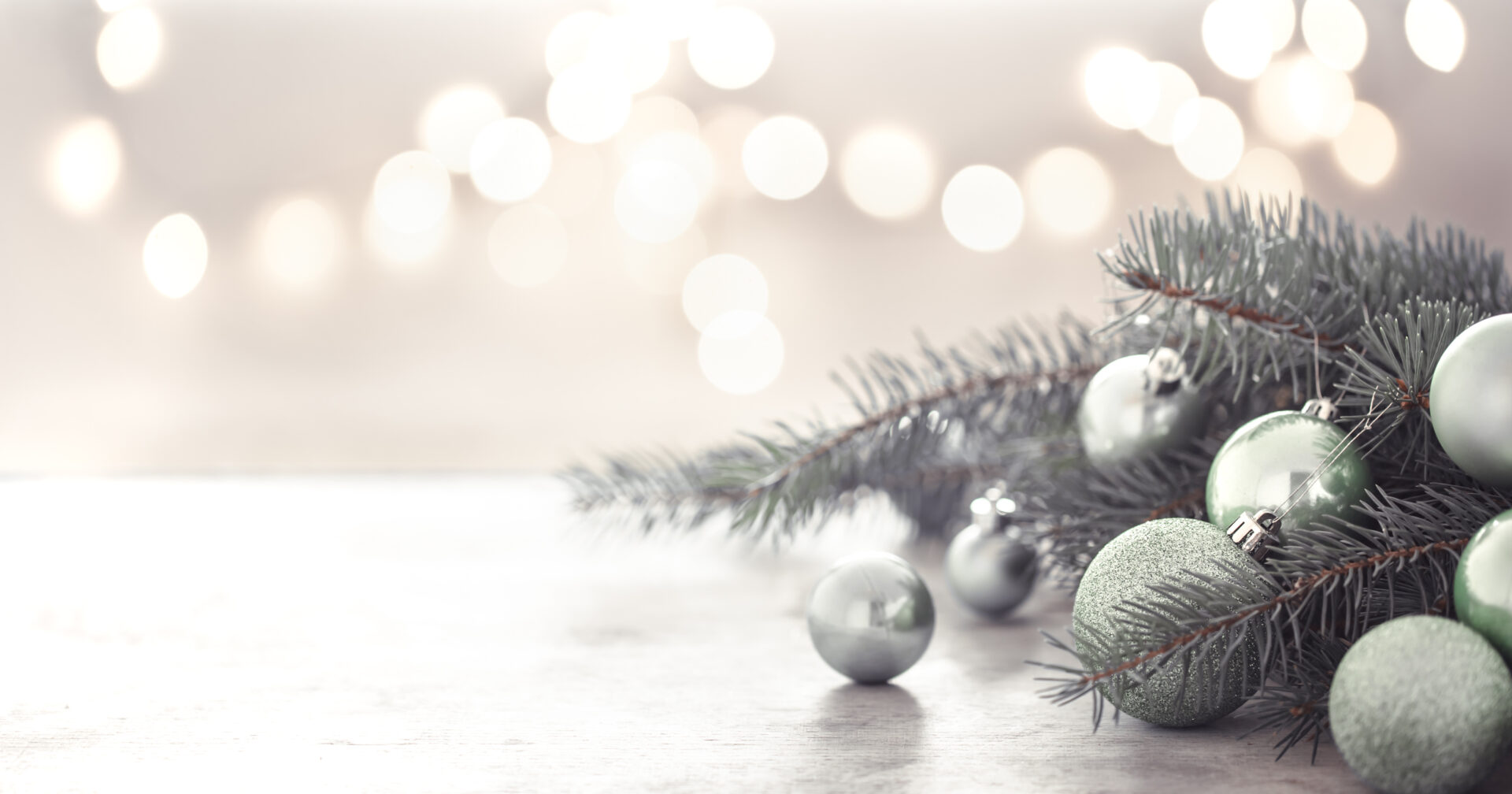 Christmas decorations on a table with a bokeh background.