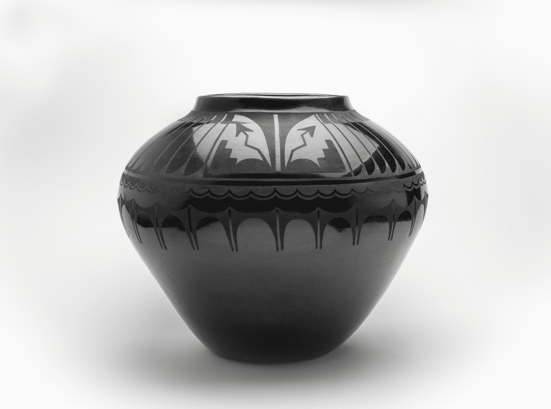 A black vase on a white background.