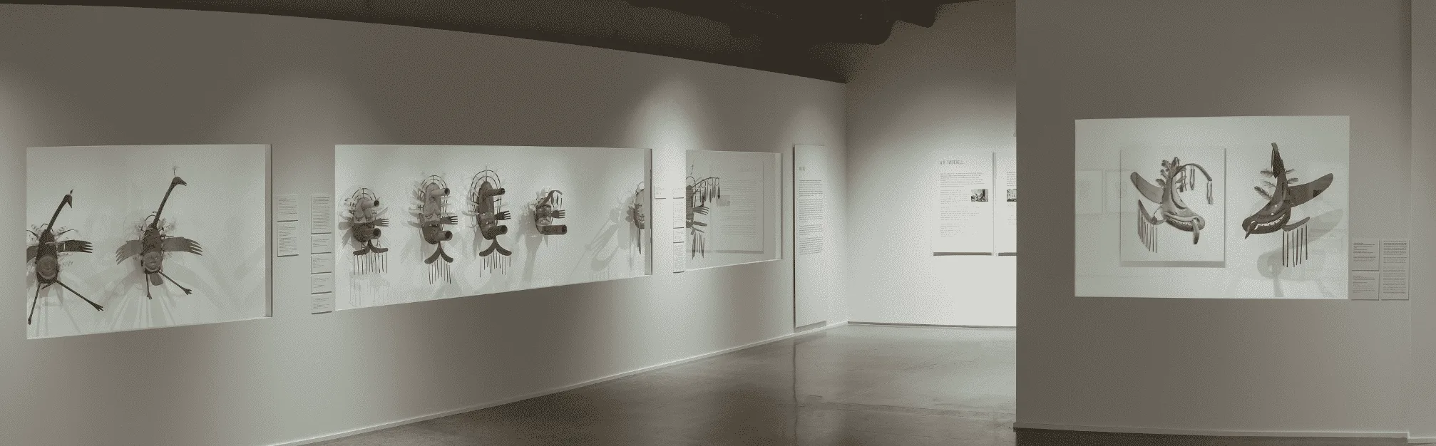 A black and white image of a museum with a lot of plants on display.