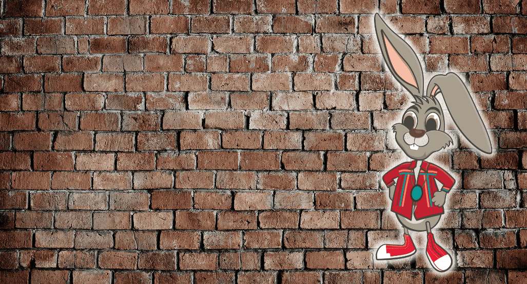 Illustration of a cheerful cartoon rabbit in a red jacket and sneakers, standing against a textured brick wall background.