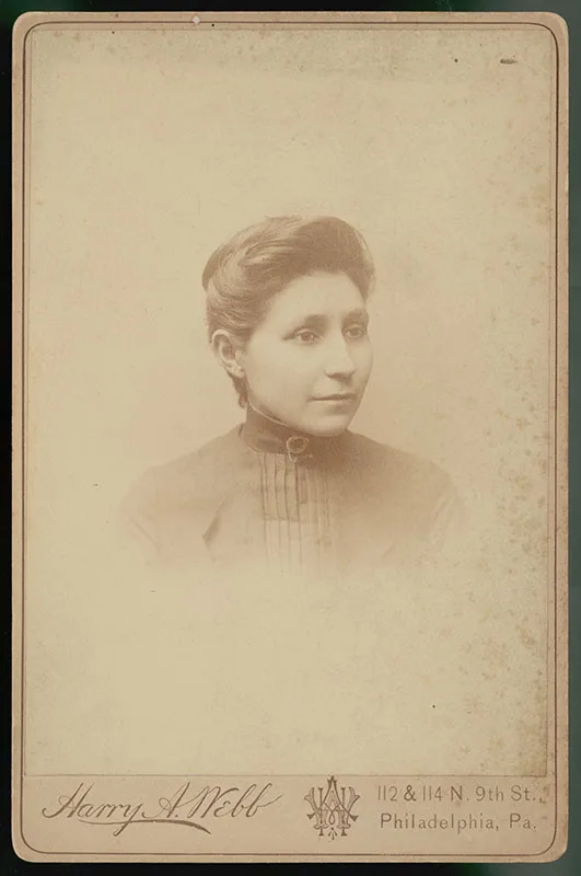 Sepia-toned portrait of a person with short hair in formal clothing, taken by Harry A. Webb in Philadelphia, Pa. The card also shows the address "112 & 114 N. 9th St., Philadelphia, Pa.".