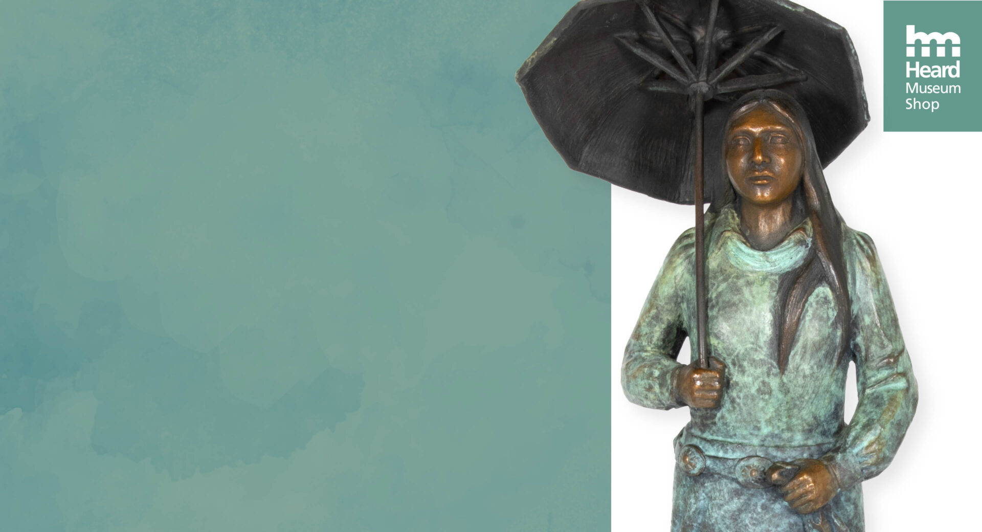 Bronze sculpture of a woman standing with an umbrella, displayed against a split teal and white background with a Heard Museum Shop logo in the upper right corner.