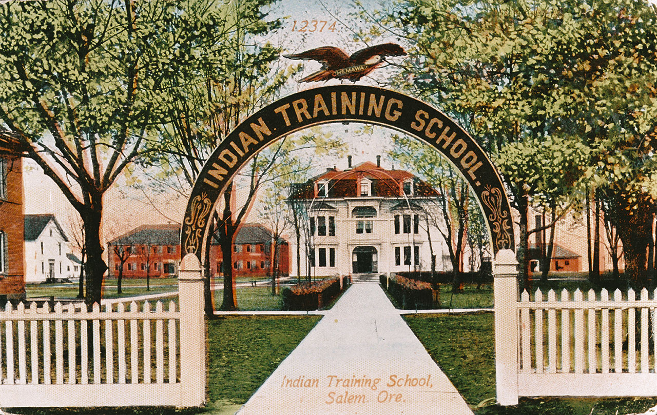 Colorized photo of the entrance to the Chemewa Indian Training School in Salem, OR around 1900.