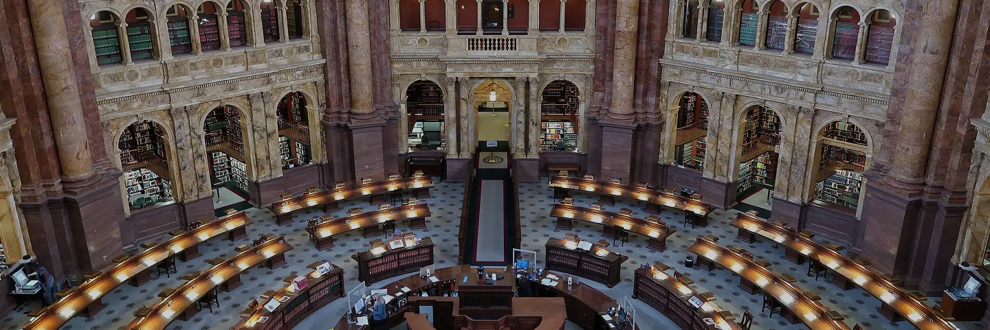 Library of Congress' large, open room with curved desks arranged in stadium style