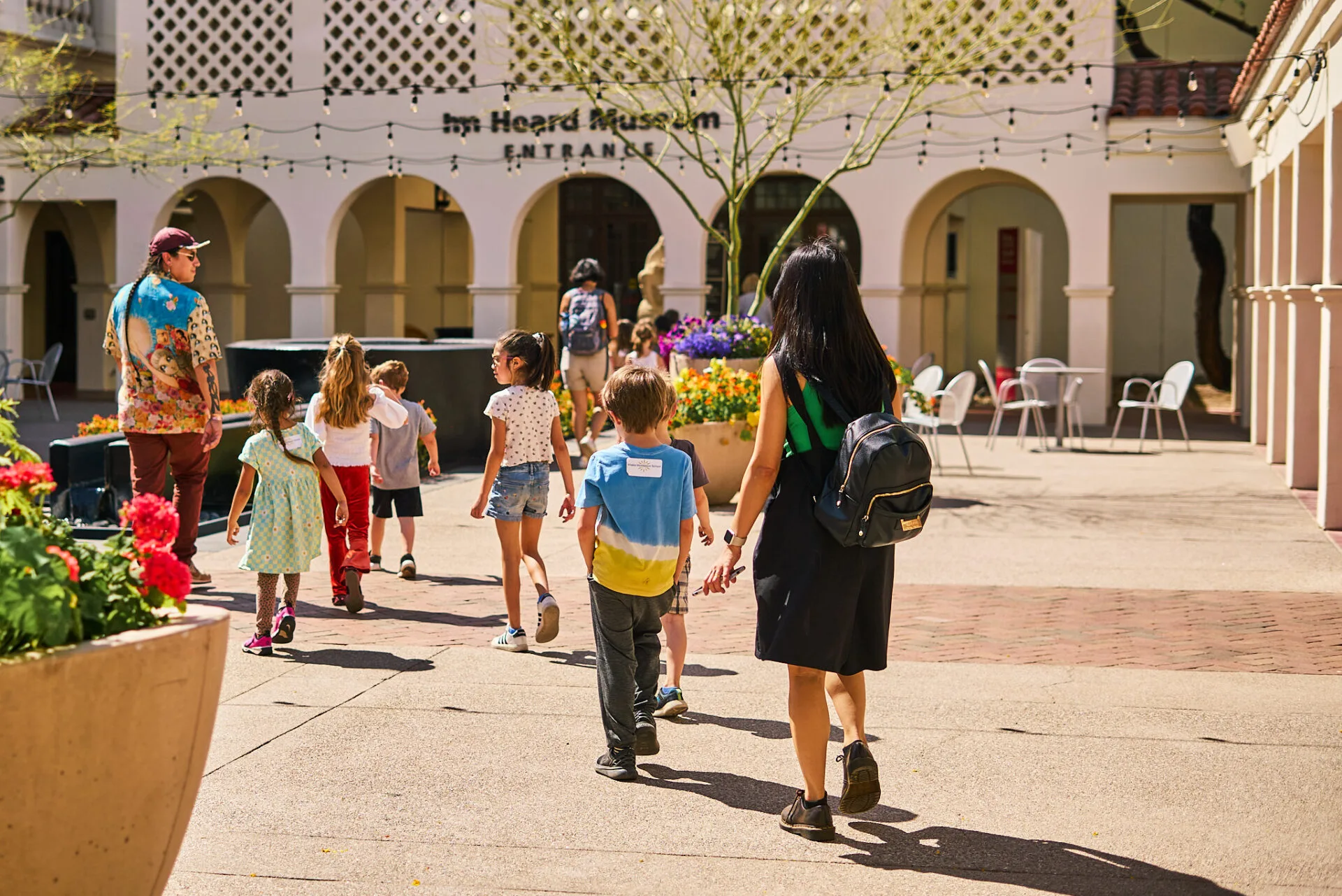 School tour walks through the Heard outdoor spaces